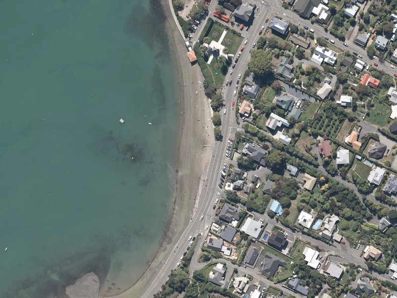 aerial view of Akaroa Beach and the ground around it