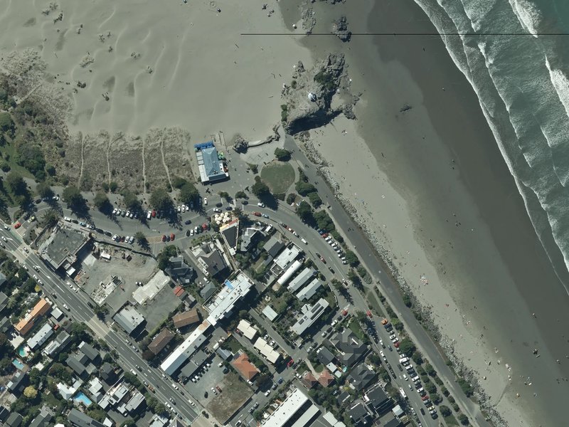 aerial view of Matuku-takotako / Sumner Beach and the ground around it
