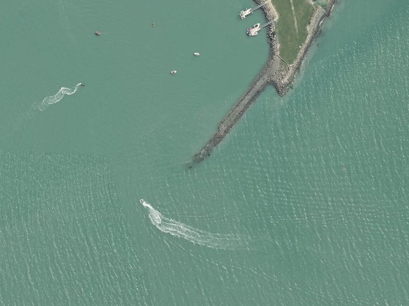 aerial view of Naval Point / Te Nukutai o Tapoa and the ground around it