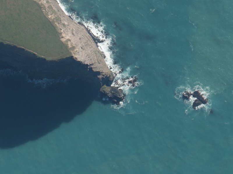 aerial view of Poutākoro Head and the ground around it