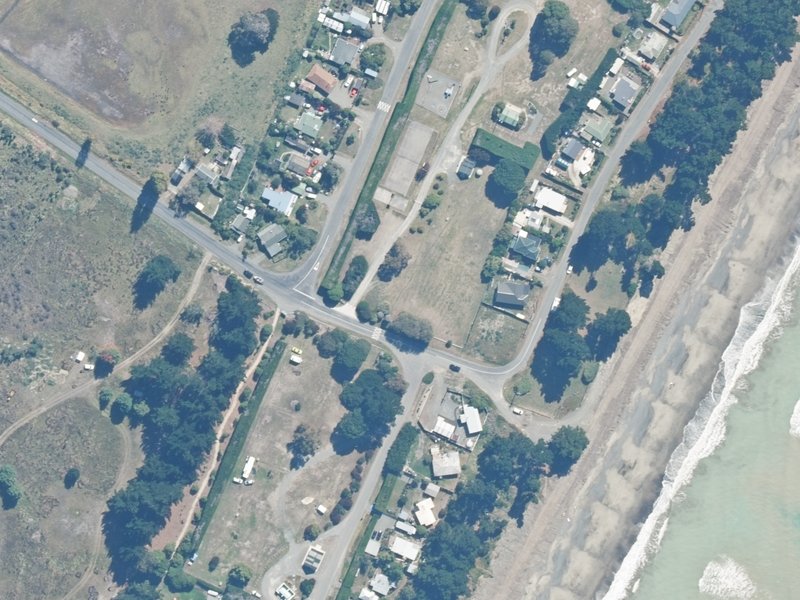 aerial view of Amberley Beach Camping Ground, 1 Chamberlain Avenue and the ground around it