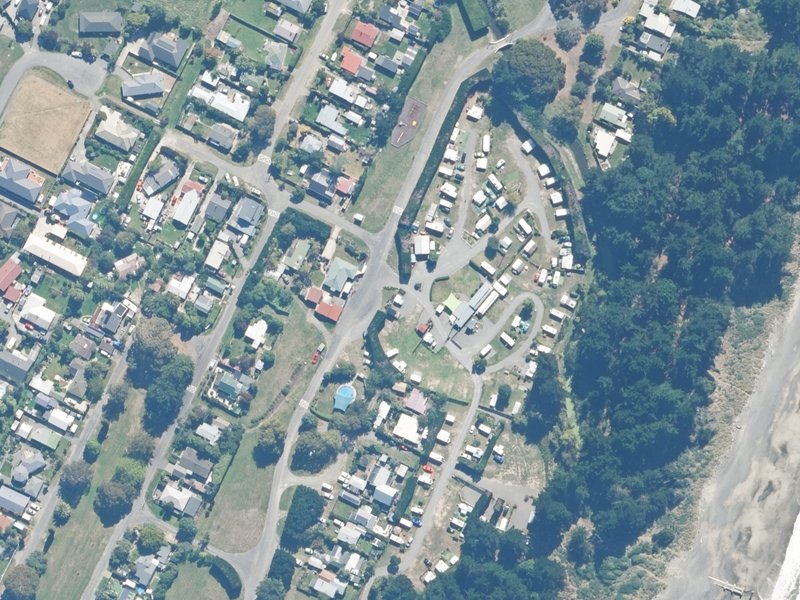 aerial view of Leithfield Beach Motor Camp, 1 Lucas Drive and the ground around it
