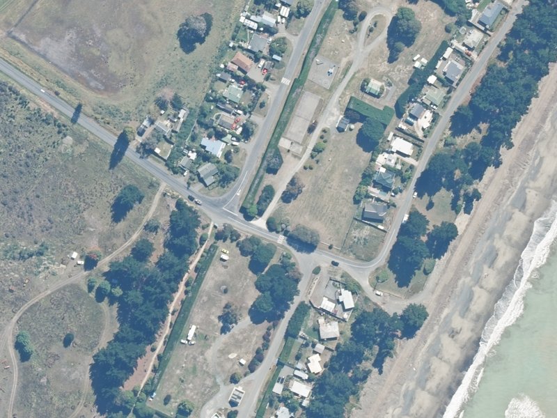 aerial view of Amberley Beach Camping Ground, 1 Chamberlain Avenue and the ground around it
