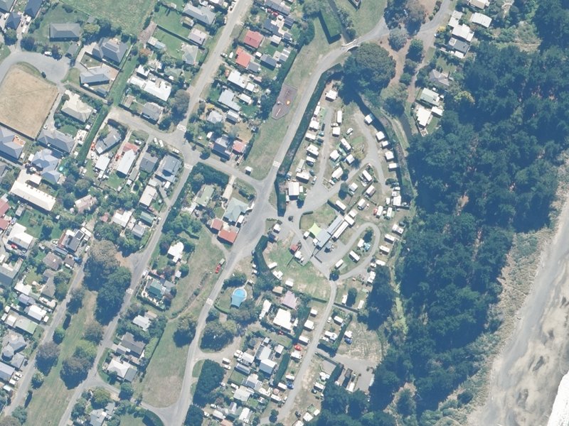 aerial view of Leithfield Beach Motor Camp, 1 Lucas Drive and the ground around it
