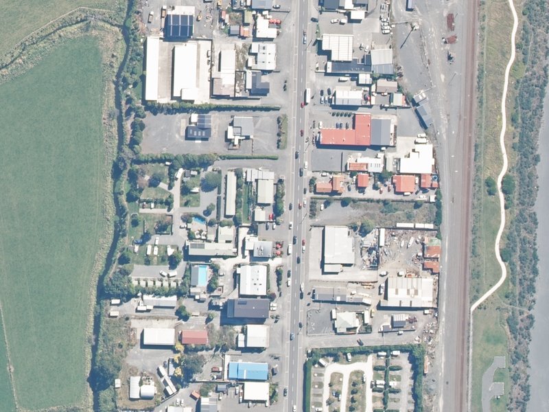 aerial view of Alpine-Pacific Holiday Park and the ground around it