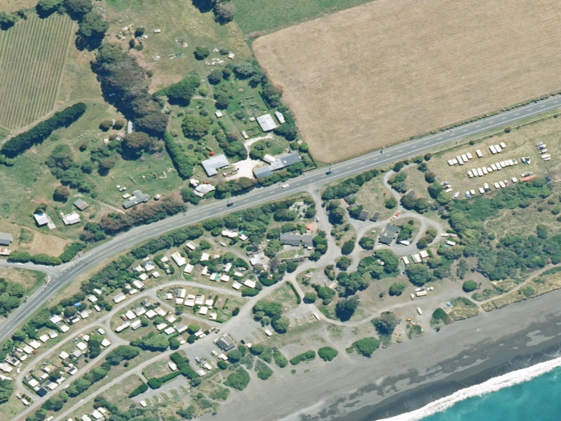 aerial view of Peketa Beach Holiday Park and the ground around it