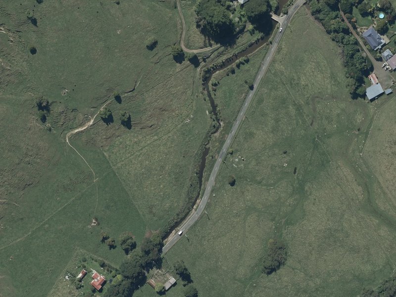 aerial view of Okains Bay Esplanade Reserve and the ground around it