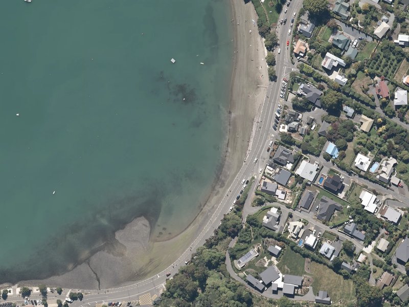 aerial view of Akaroa Beach and the ground around it
