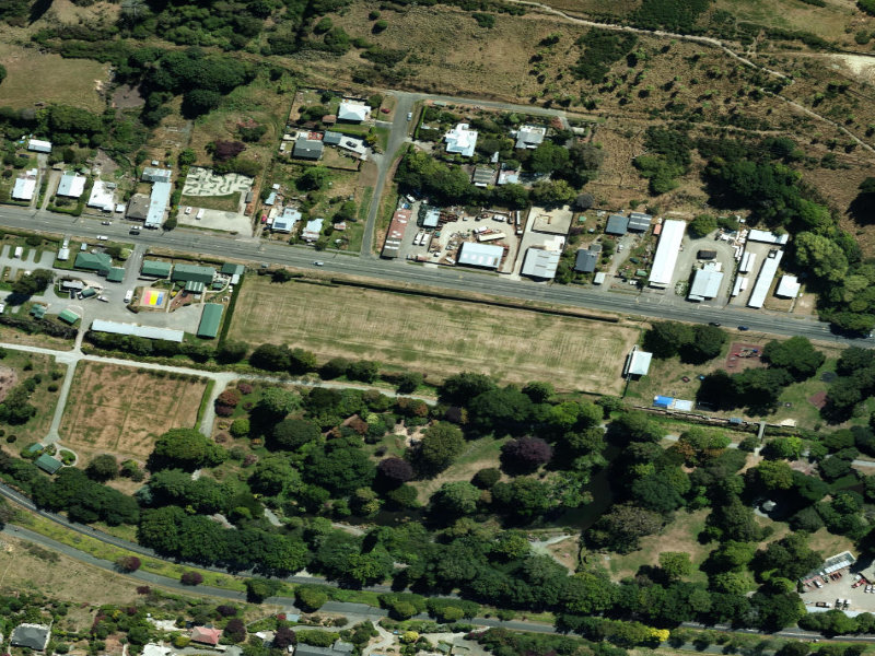 aerial view of Tennis Courts Public Gardens and the ground around it