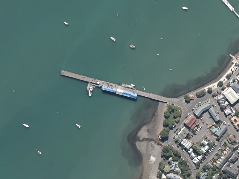 aerial view of Akaroa Town Wharf and the ground around it