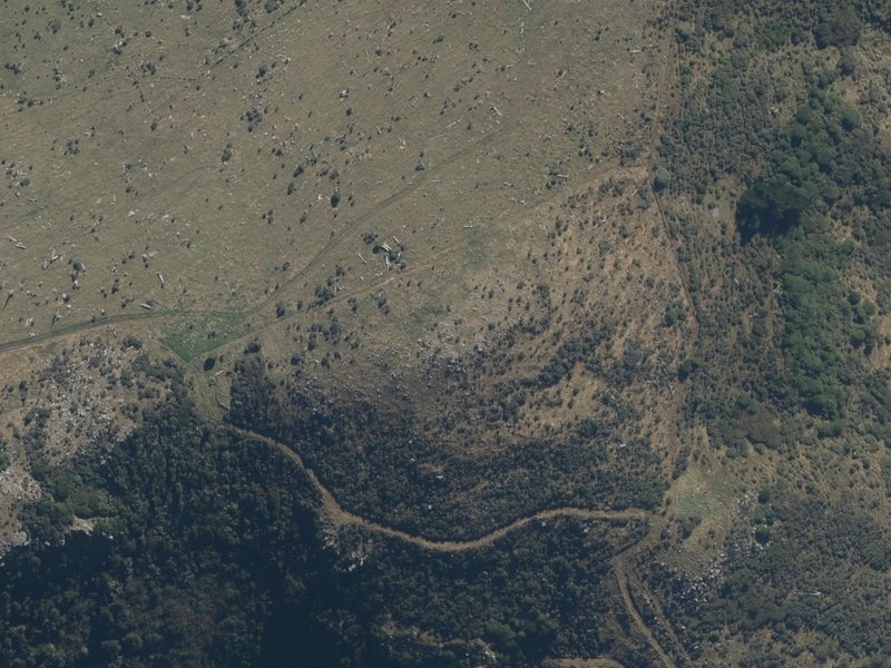 aerial view of Duvauchelle Peak and the ground around it