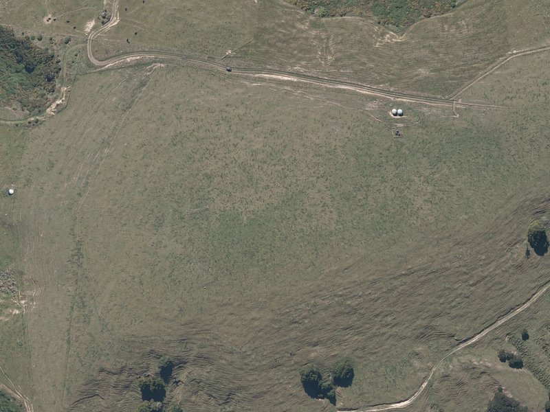 aerial view of Takamatua Hill and the ground around it