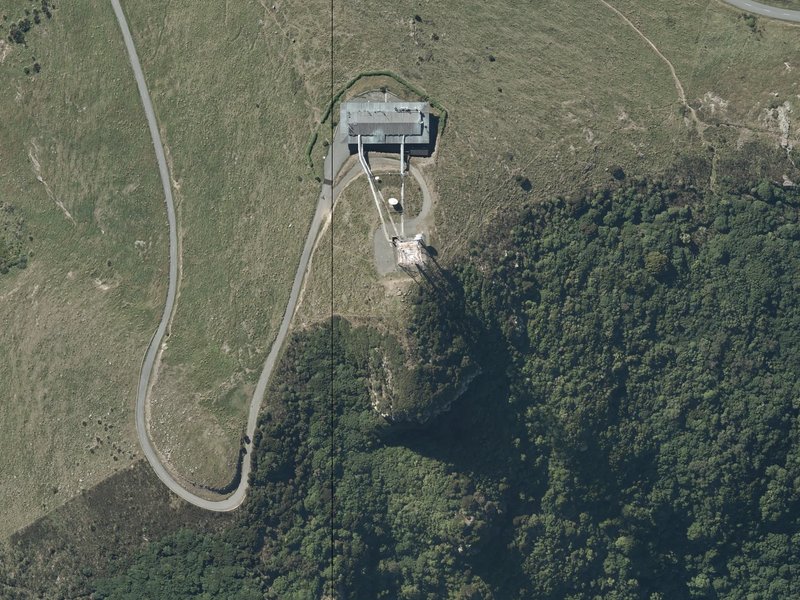 aerial view of Te Heru-o-Kahukura / Sugarloaf and the ground around it