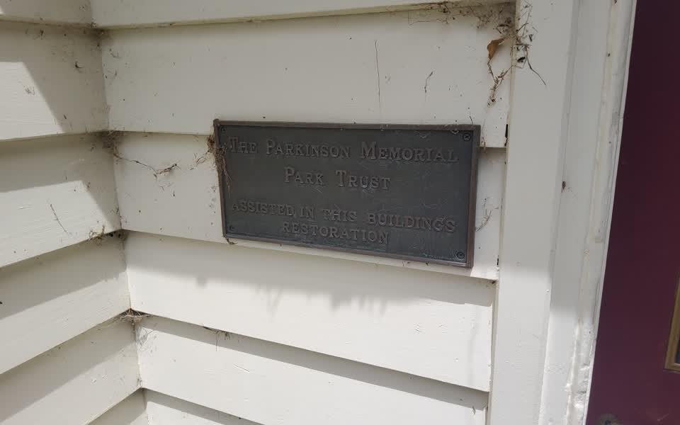 the register’s photograph of the plaque at Port Levy Former School Site