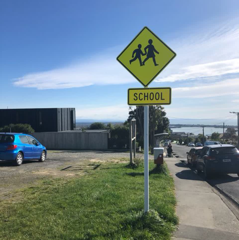 The photograph attached to this damaged street sign report