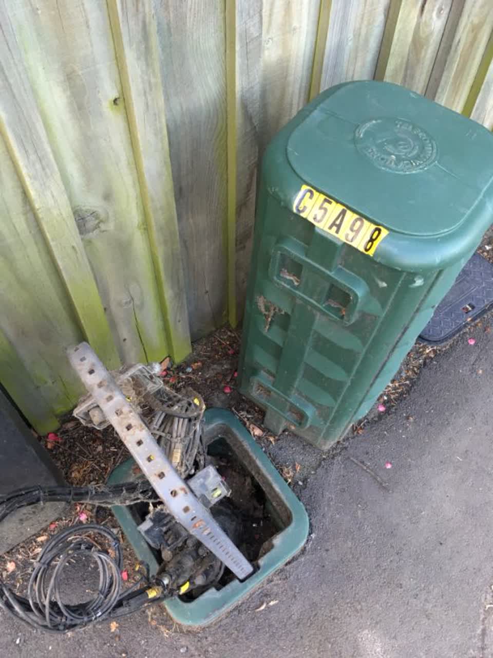 The photograph attached to this damaged street sign report
