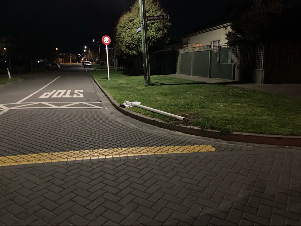 The photograph attached to this damaged street sign report