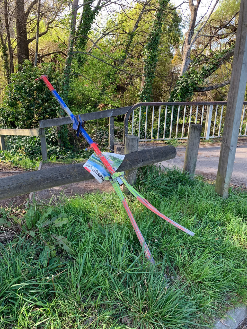 The photograph attached to this damaged street sign report