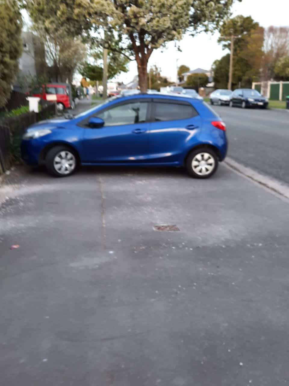 The photograph attached to this parking - illegal report