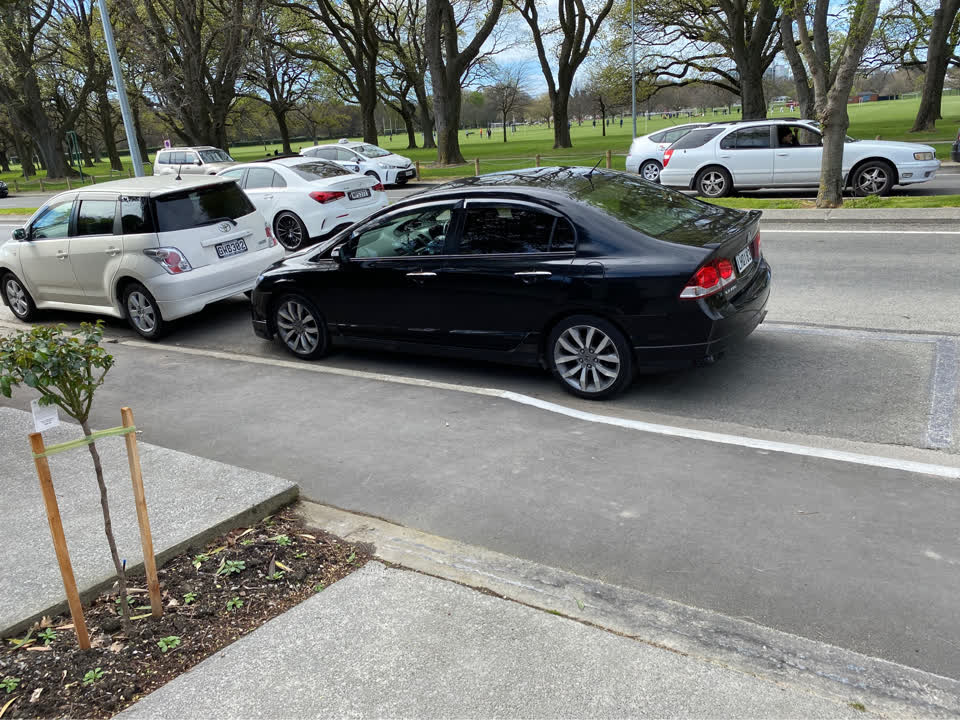 The photograph attached to this parking - illegal report