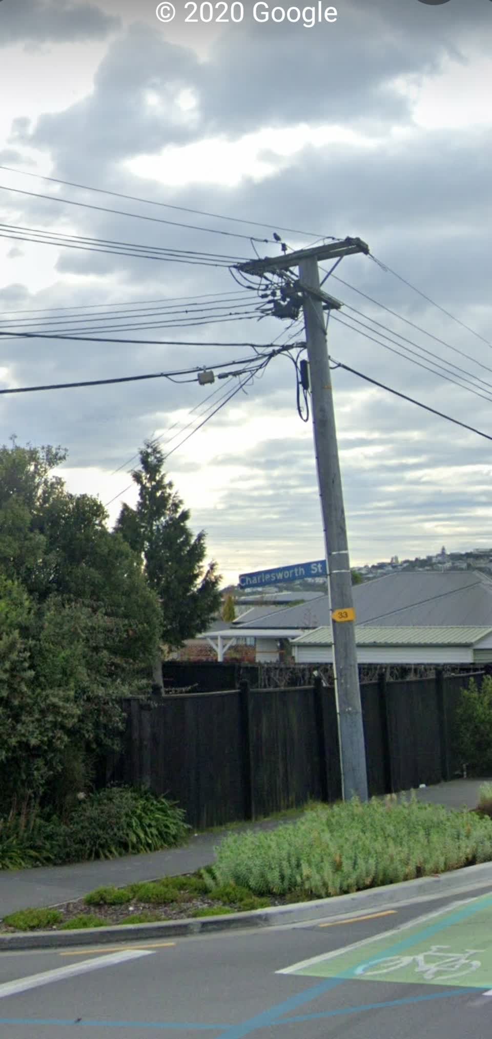 The photograph attached to this damaged street sign report
