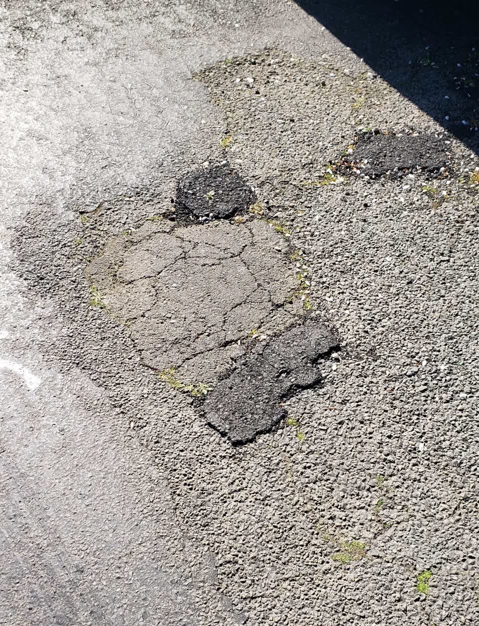 The photograph attached to this damaged road report