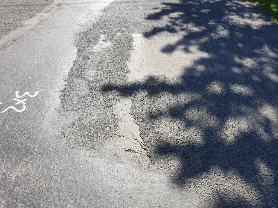 The photograph attached to this damaged road report