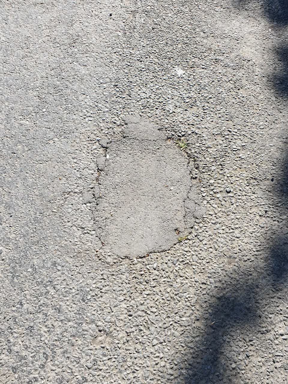 The photograph attached to this damaged road report