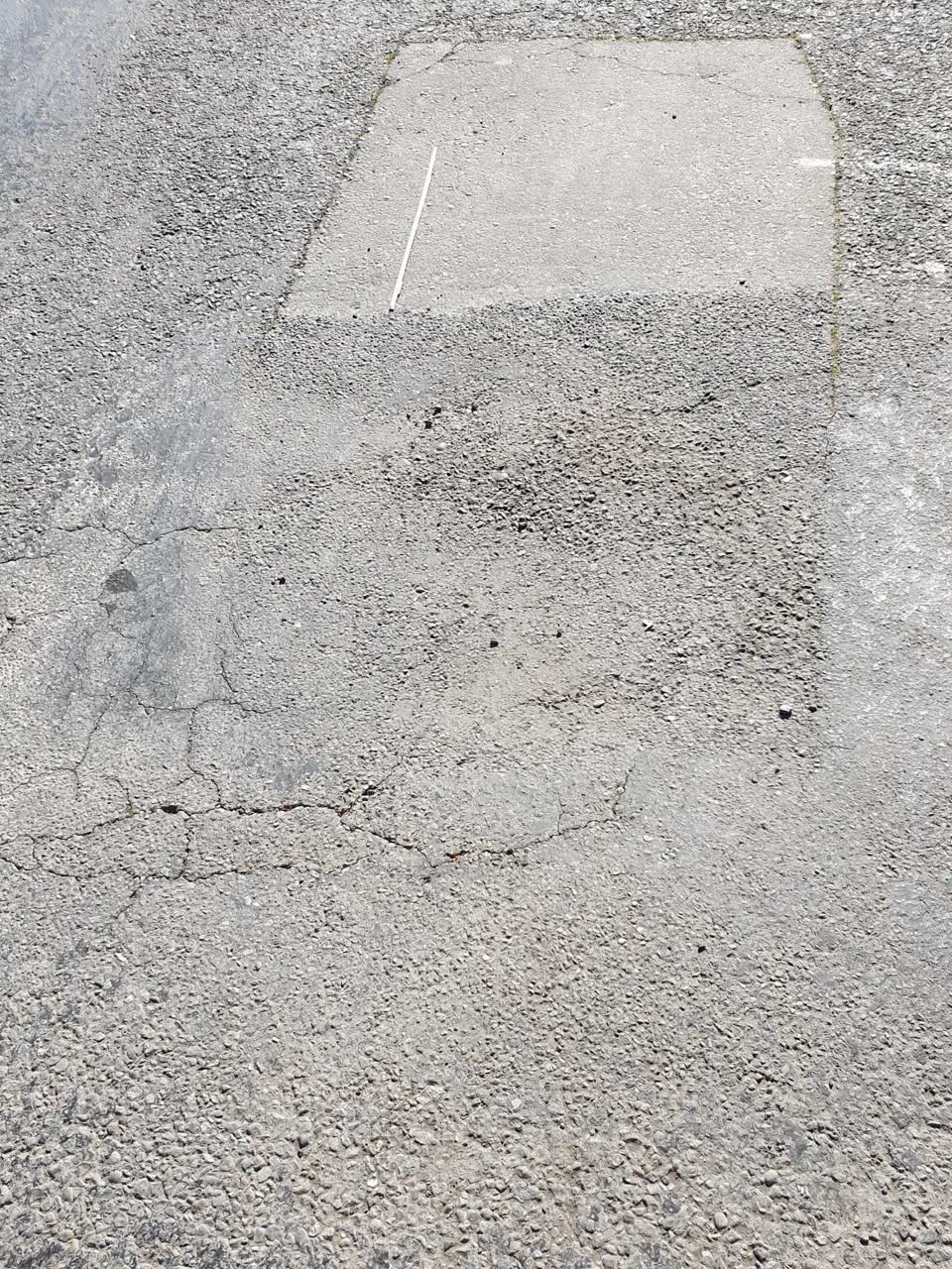 The photograph attached to this damaged road report