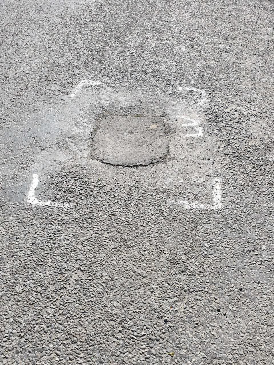 The photograph attached to this damaged road report