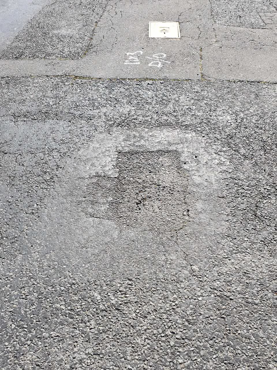 The photograph attached to this damaged road report
