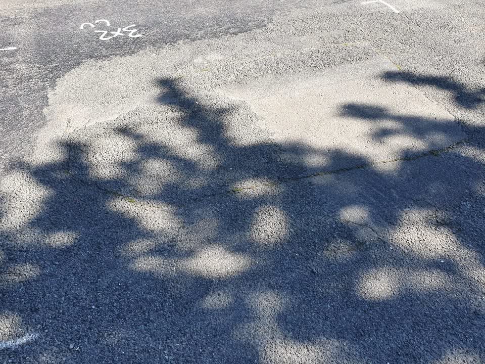 The photograph attached to this damaged road report