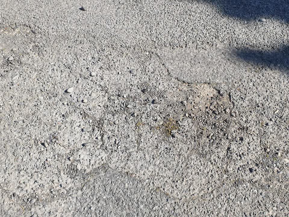 The photograph attached to this damaged road report