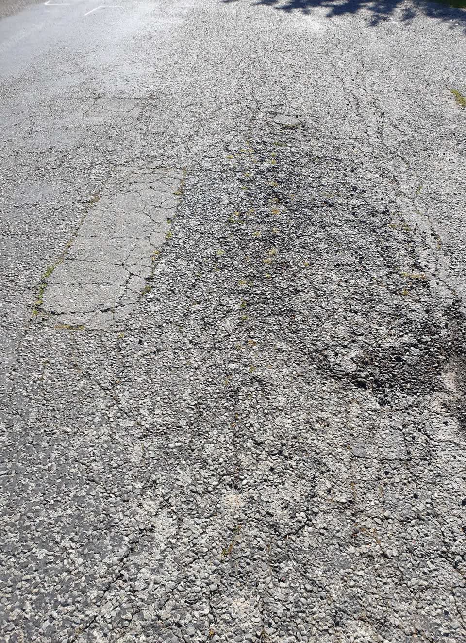 The photograph attached to this damaged road report