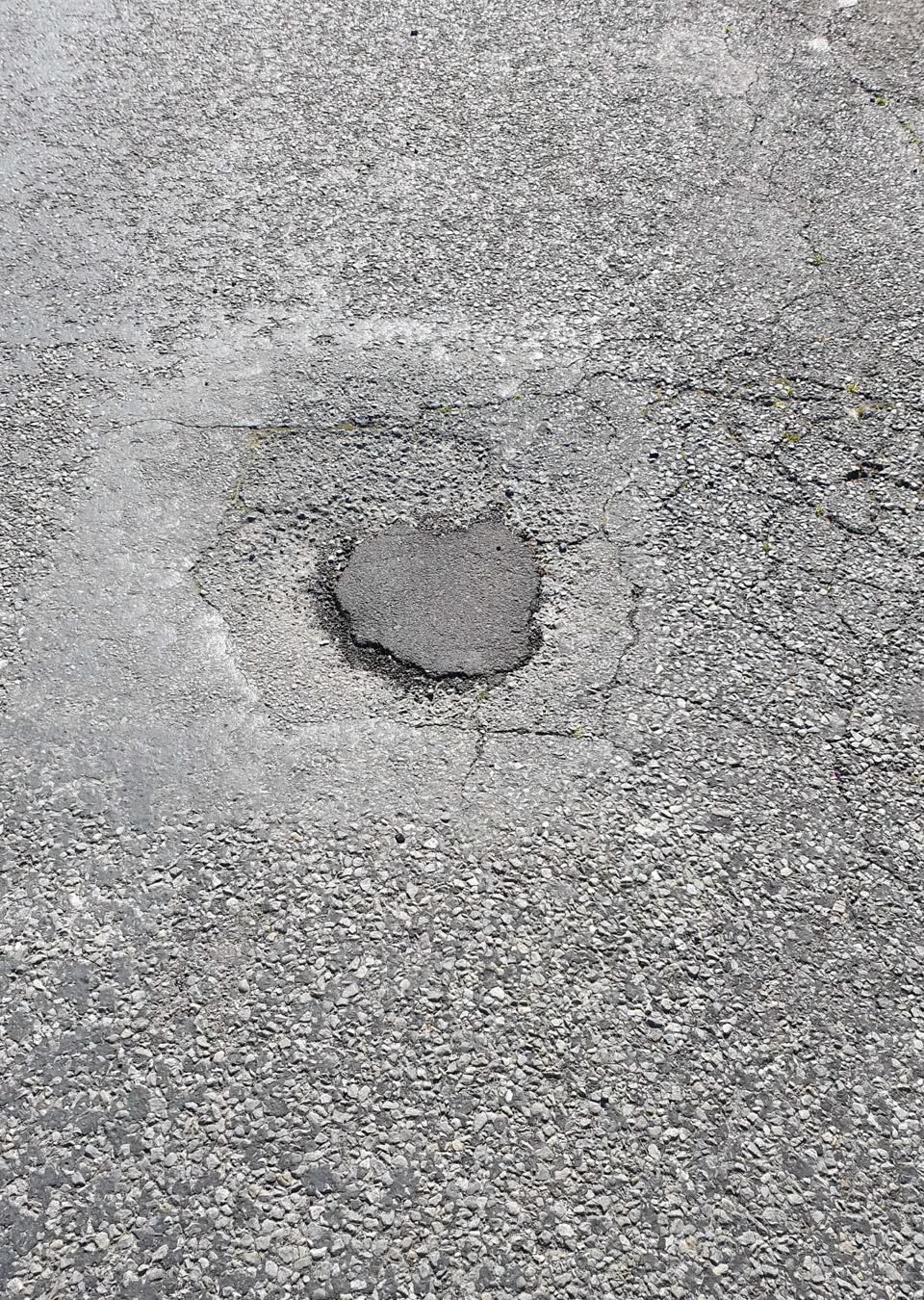 The photograph attached to this damaged road report