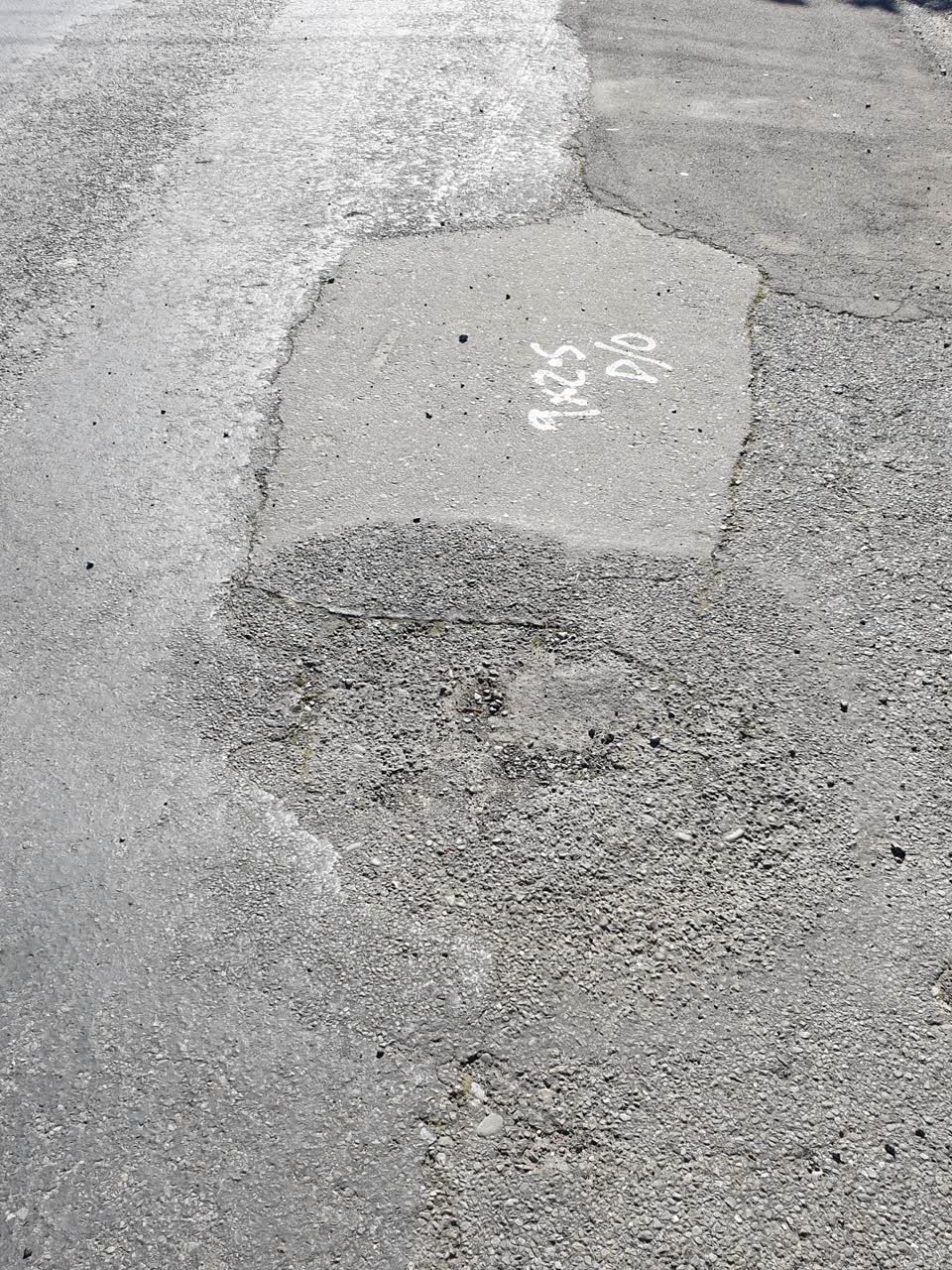 The photograph attached to this damaged road report