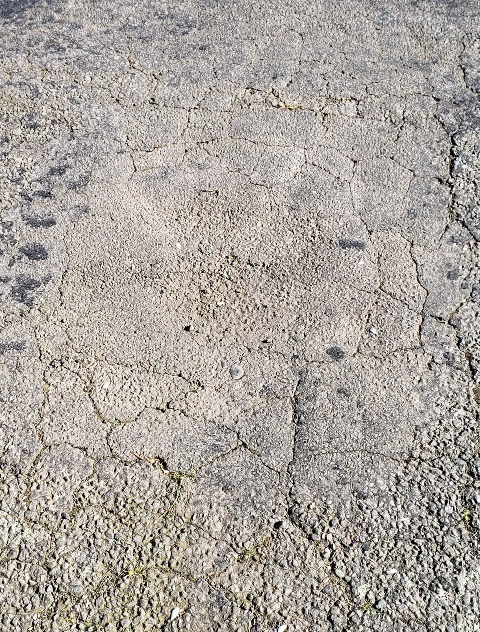 The photograph attached to this pothole report