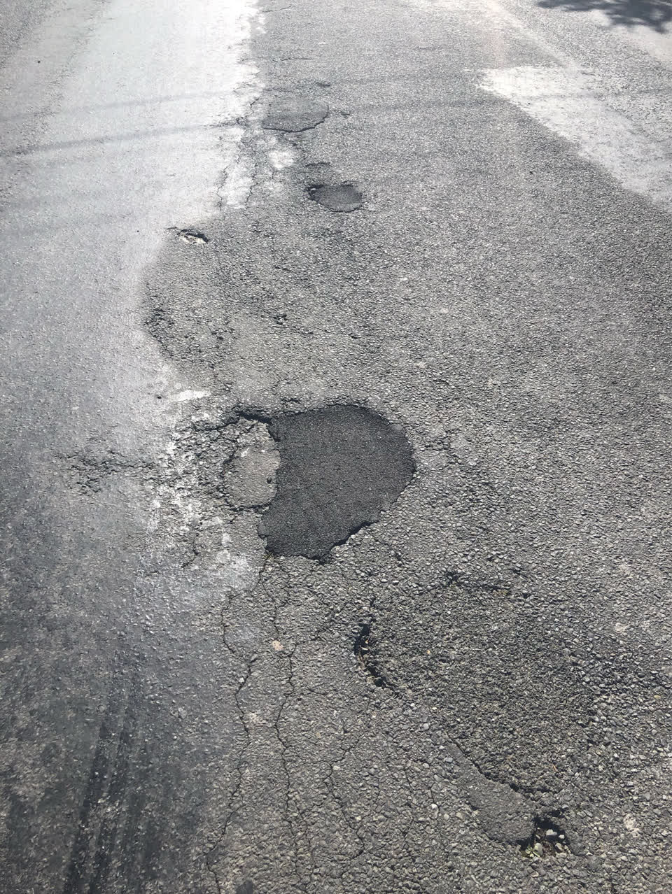 The photograph attached to this damaged road report
