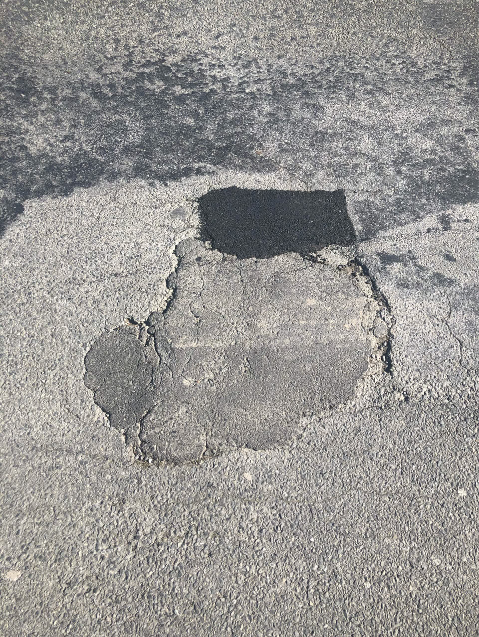 The photograph attached to this damaged road report