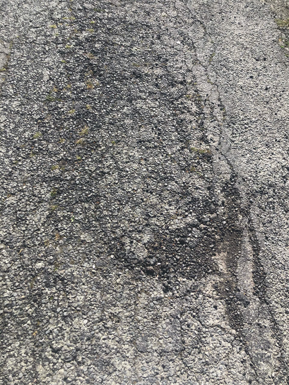 The photograph attached to this damaged road report