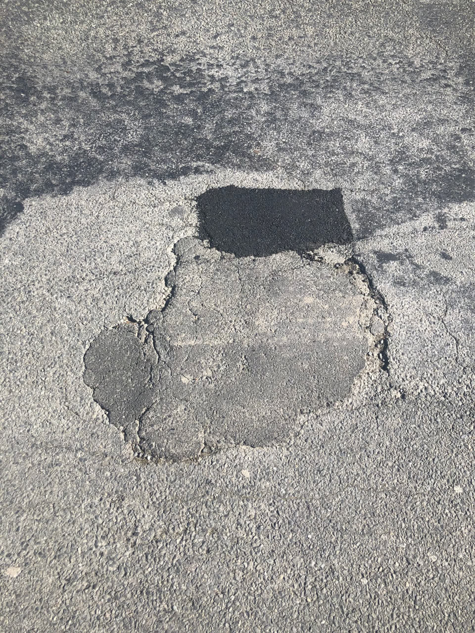 The photograph attached to this pothole report