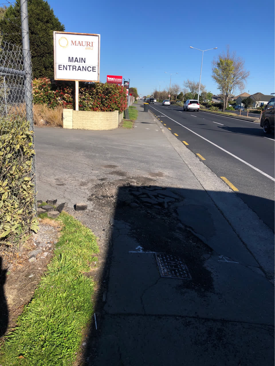 The photograph attached to this pavement - damaged report