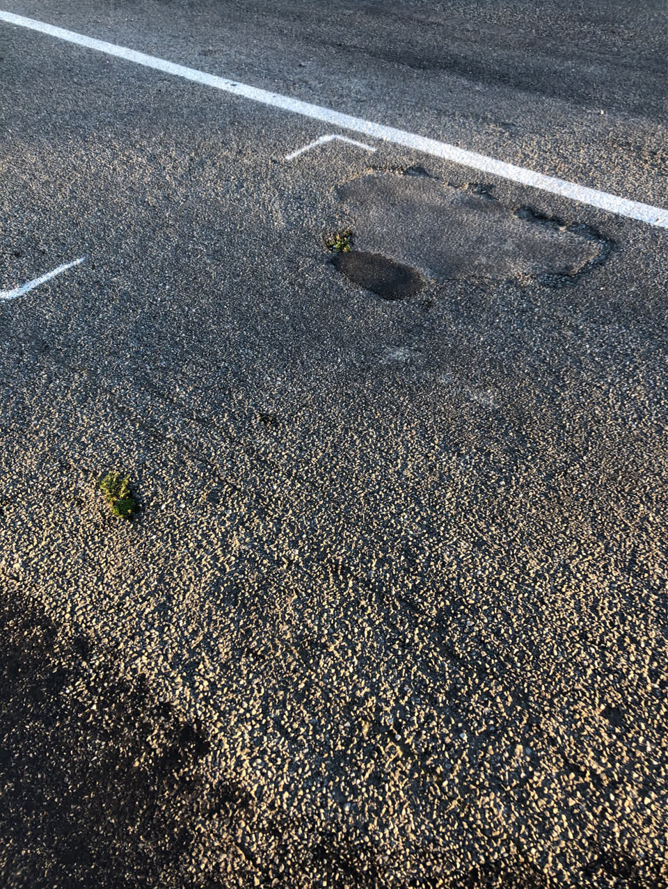 The photograph attached to this damaged road report