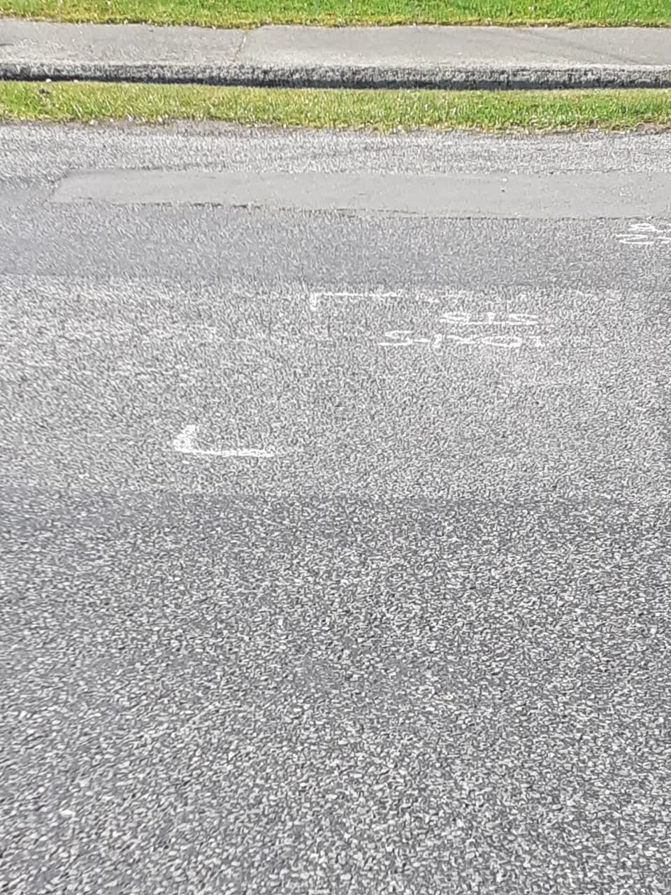 The photograph attached to this damaged road report