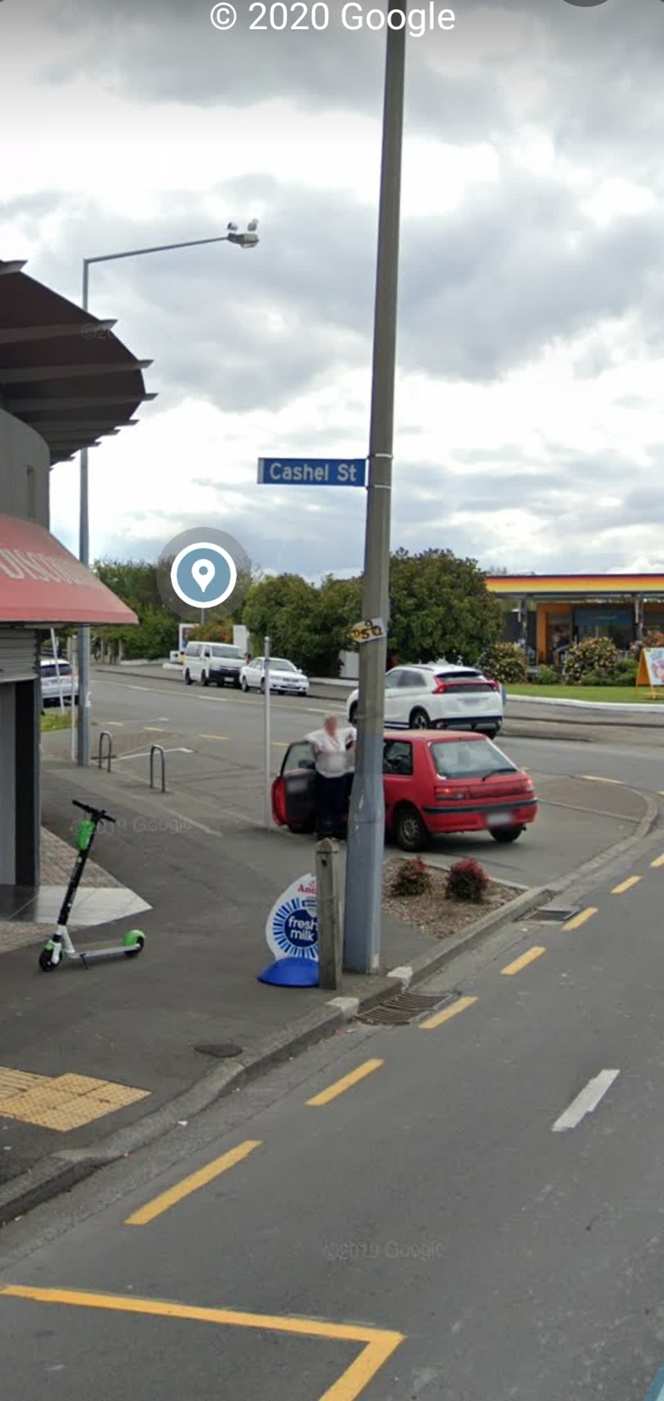 The photograph attached to this damaged street sign report