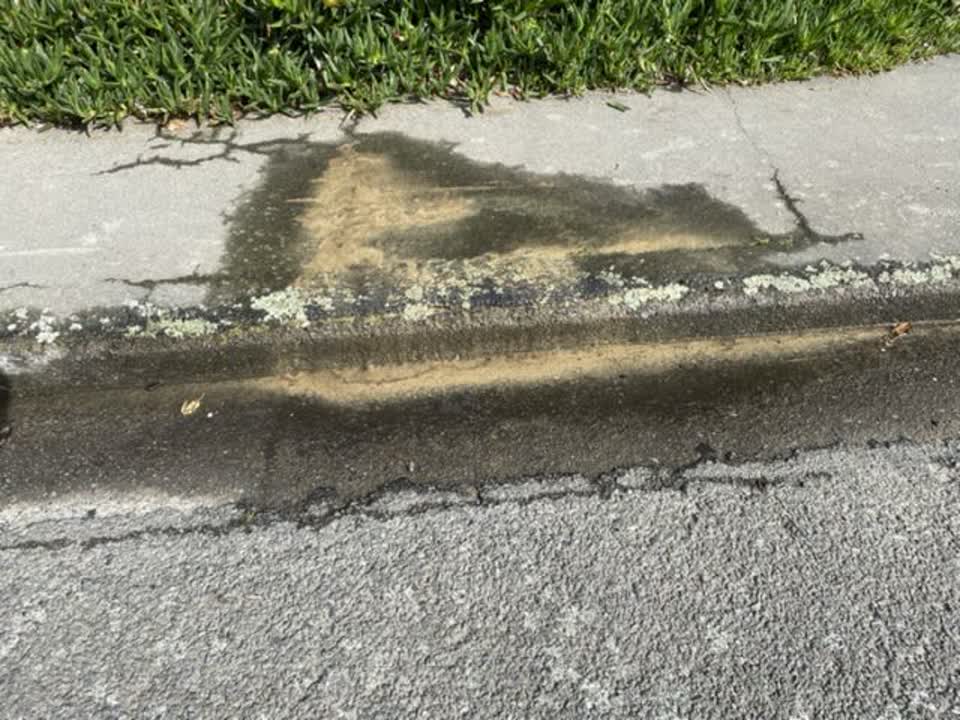 The photograph attached to this pavement - damaged report