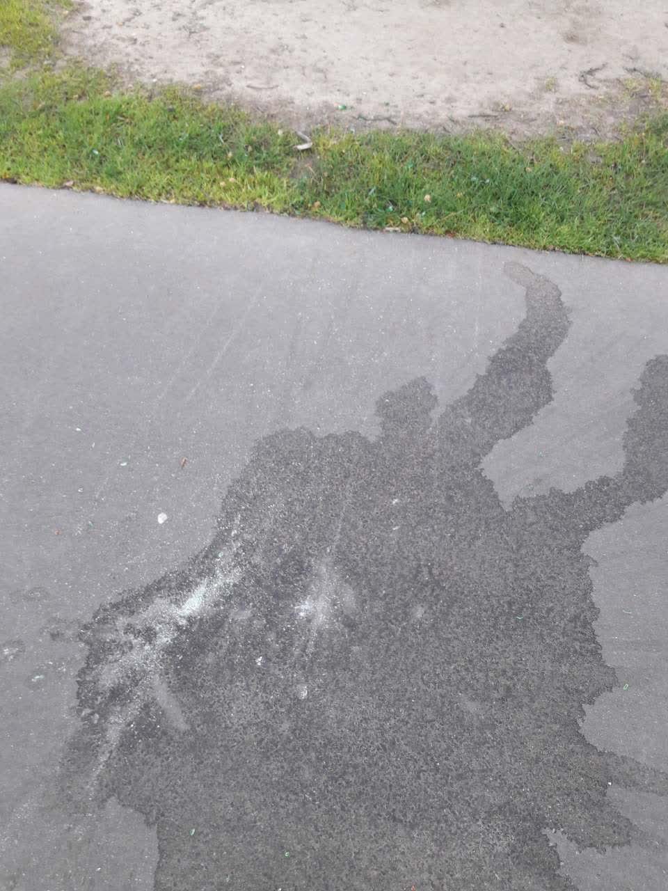 The photograph attached to this pavement - damaged report