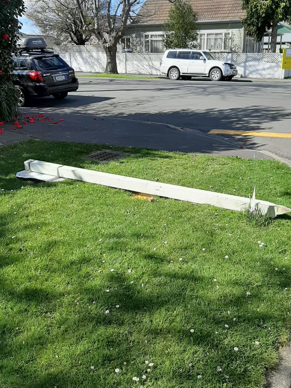 The photograph attached to this damaged street sign report