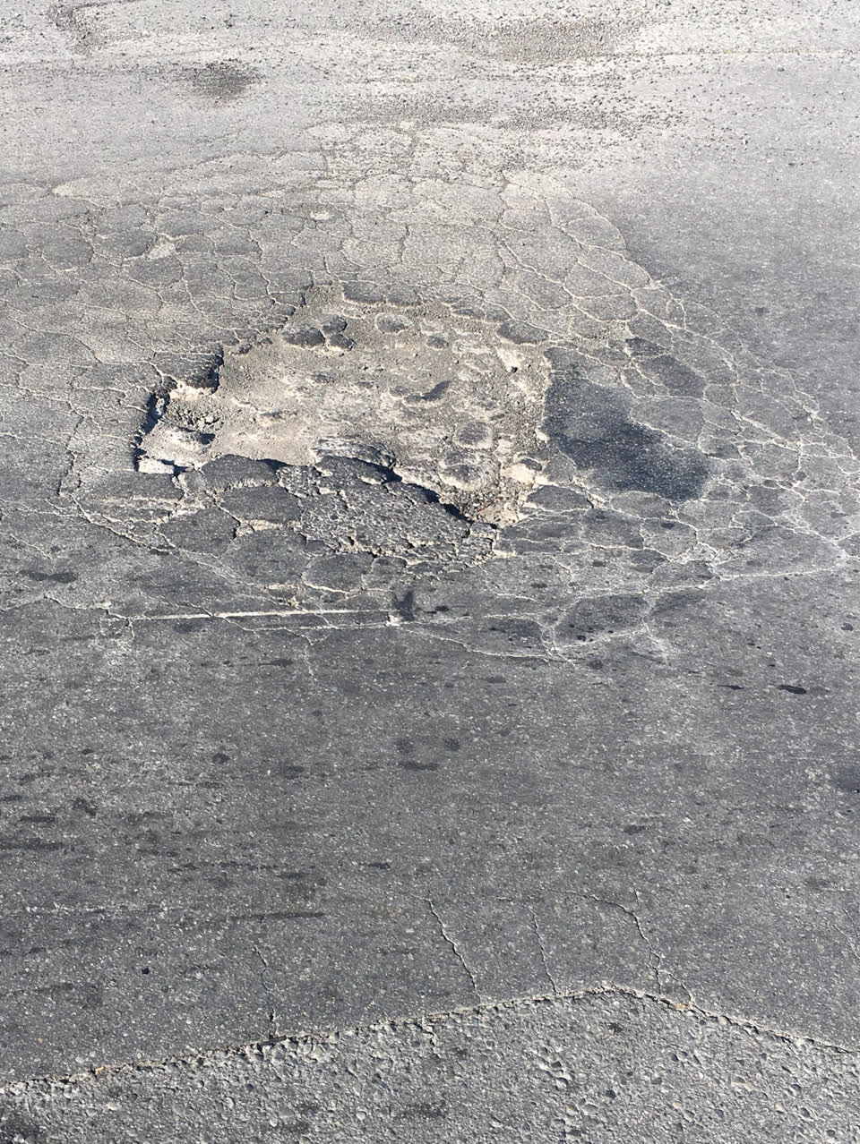The photograph attached to this damaged road report