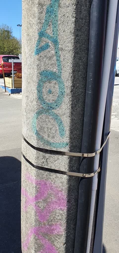 Graffiti - Concrete Street Light Pole, a report photo
